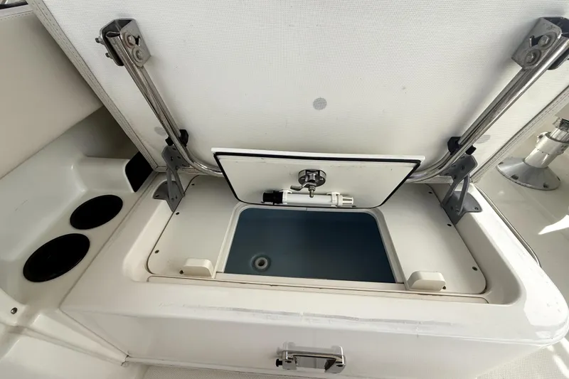 Slide: The Image of Open storage compartment on a 2018 Boston Whaler 230 Vantage boat. - 15