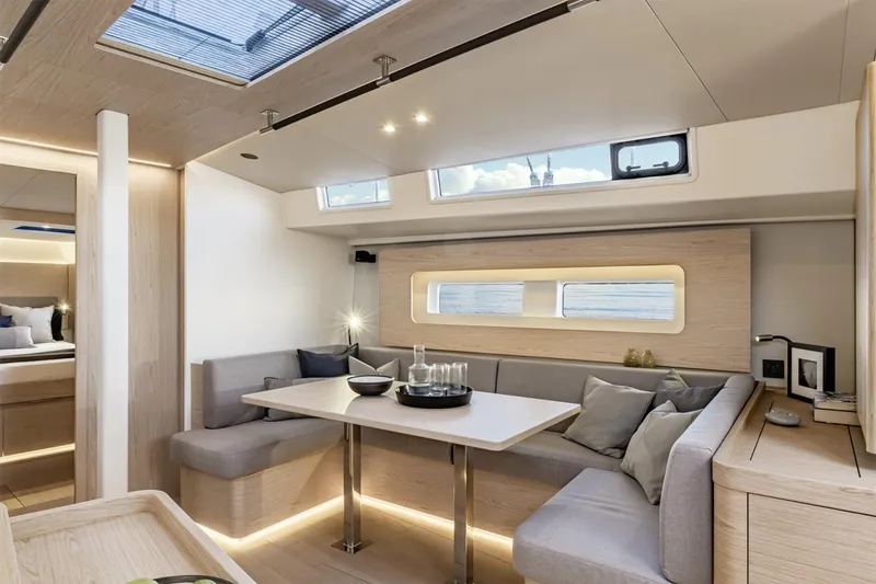 Slide: The Image of Manufacturer Provided Image: Luxurious interior of 2026 Beneteau Oceanis Yacht 54 with modern seating and skylight. - 6