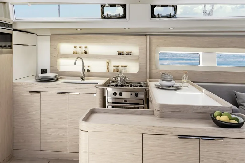 Slide: The Image of Manufacturer Provided Image: Luxurious kitchen interior of 2026 Beneteau Oceanis Yacht 54 with modern amenities and ocean view. - 7