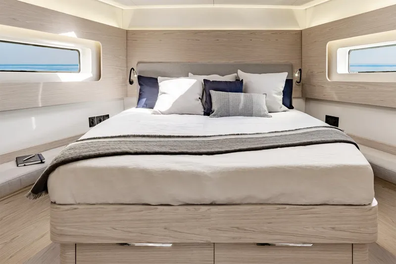 Slide: The Image of Manufacturer Provided Image: Luxurious bedroom interior of 2026 Beneteau Oceanis Yacht 54 with modern design and cozy bedding. - 8