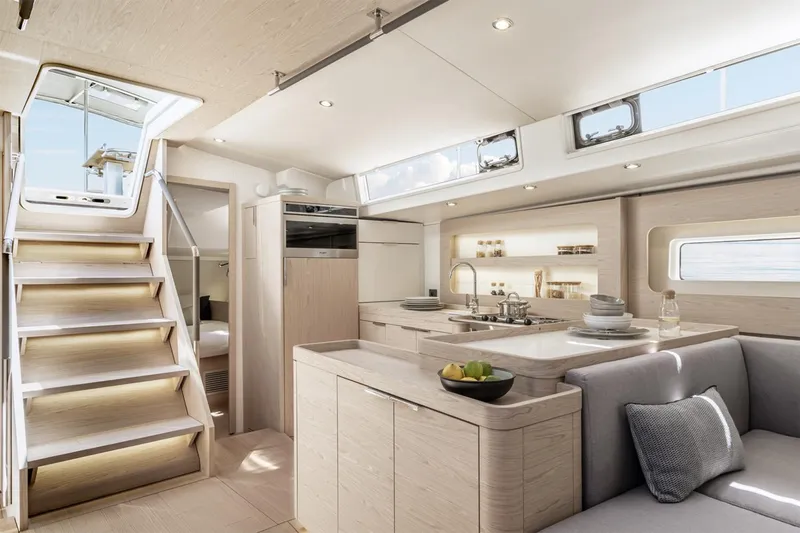 Slide: The Image of Manufacturer Provided Image: Luxurious interior of 2026 Beneteau Oceanis Yacht 54, featuring modern kitchen and seating area. - 5
