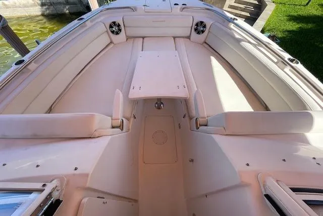 Slide: The Image of 2021 Grady-White Freedom 325 boat interior with spacious seating and table. - 101