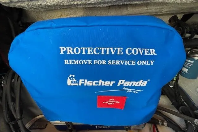 Slide: The Image of Blue protective cover on Fischer Panda generator, Grady-White Freedom 325, 2021 model. - 90