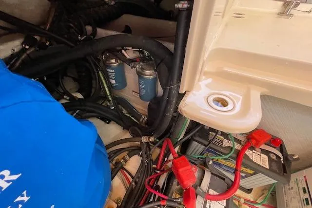 Slide: The Image of Engine compartment of a 2021 Grady-White Freedom 325 boat, showing wiring and components. - 94