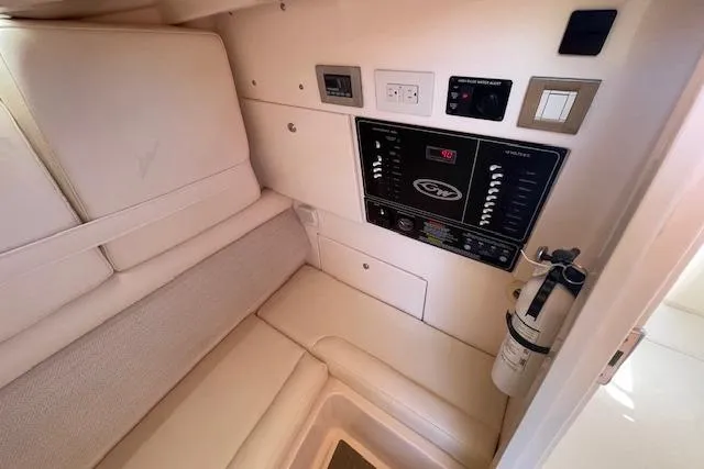 Slide: The Image of 2021 Grady-White Freedom 325 cabin interior with control panel and seating area. - 60
