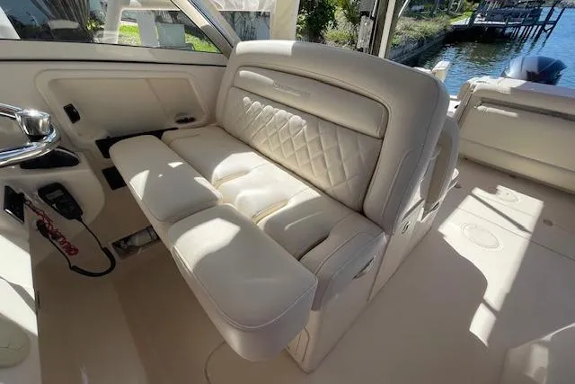 Slide: The Image of 2021 Grady-White Freedom 325 boat interior with luxurious white seating. - 39