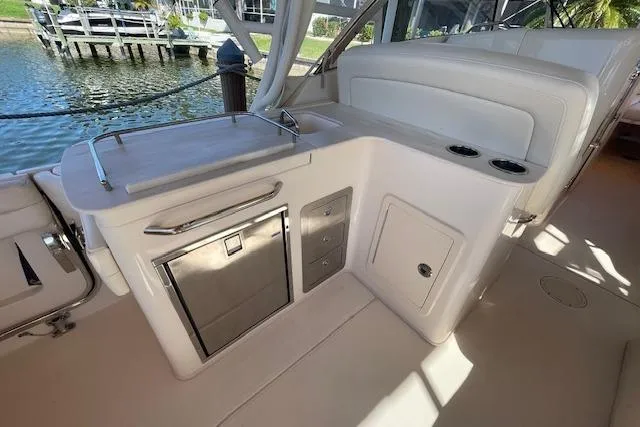 Slide: The Image of 2021 Grady-White Freedom 325 boat interior with kitchenette and storage compartments. - 25