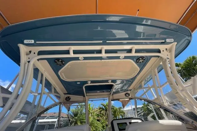 Slide: The Image of 2021 Grady-White Freedom 325 boat interior with blue canopy and white framework. - 70