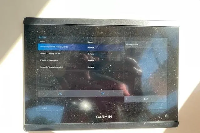 Slide: The Image of Garmin device interface on a 2021 Grady-White Freedom 325 boat, displaying connected devices. - 44