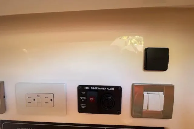 Slide: The Image of Control panel on 2021 Grady-White Freedom 325 boat with high bilge water alert. - 64