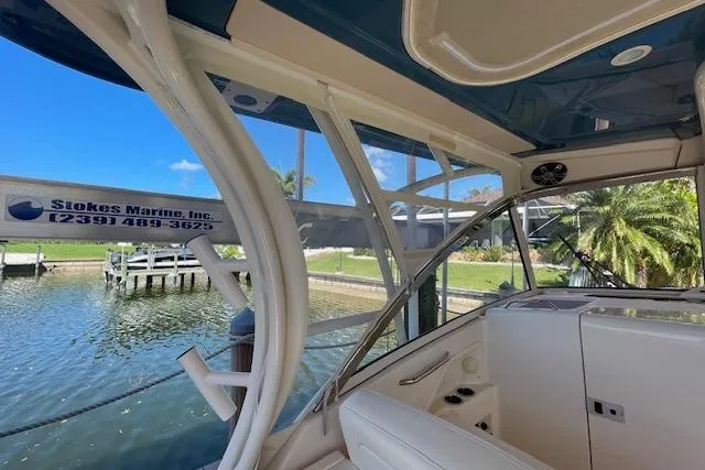 Slide: The Image of 2021 Grady-White Freedom 325 boat interior with waterway view and dock in background. - 76