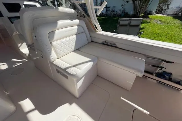 Slide: The Image of 2021 Grady-White Freedom 325 boat interior with luxurious white seating and ample space. - 36