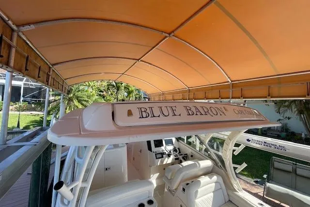 Slide: The Image of 2021 Grady-White Freedom 325 boat under canopy, named "Blue Baron." - 35