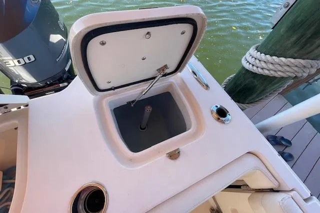 Slide: The Image of Grady-White Freedom 325 boat's open storage compartment, docked by water, 2021 model. - 30