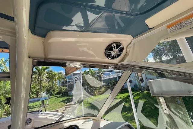 Slide: The Image of Interior view of 2021 Grady-White Freedom 325 boat, showcasing speaker and windshield. - 74