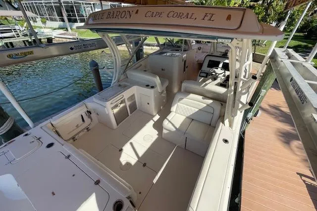 Slide: The Image of 2021 Grady-White Freedom 325 boat docked in Cape Coral, FL, featuring spacious seating and helm. - 33