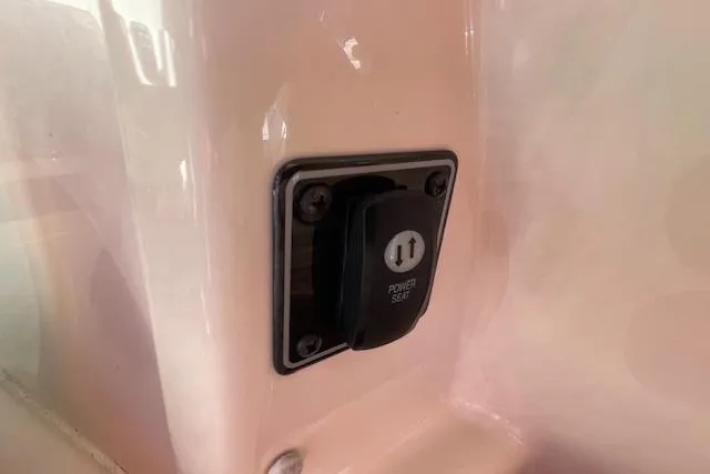 Slide: The Image of Power seat switch on 2021 Grady-White Freedom 325 boat interior. - 48