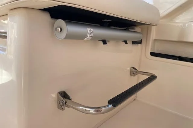 Slide: The Image of 2021 Grady-White Freedom 325 boat interior detail with stainless steel handle and hydraulic component. - 77