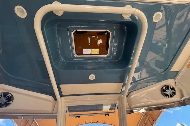Slide: The Image of 2021 Grady-White Freedom 325 boat interior ceiling with hatch and speakers. - 71
