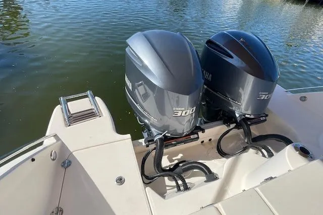 Slide: The Image of 2021 Grady-White Freedom 325 boat with twin Yamaha 300 engines on calm water. - 15