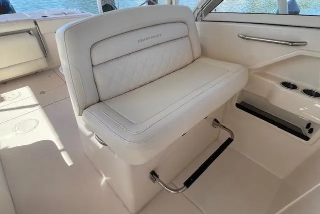 Slide: The Image of 2021 Grady-White Freedom 325 boat interior with white cushioned seating. - 50