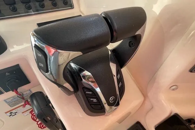 Slide: The Image of 2021 Grady-White Freedom 325 boat throttle controls, featuring modern design and functionality. - 47