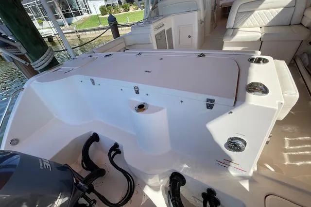 Slide: The Image of 2021 Grady-White Freedom 325 boat interior with seating and storage compartments. - 97