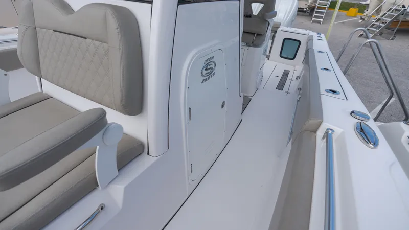 Slide: The Image of The image shows the cockpit of a 2023 Sportsman Open 282TE Center Console boat. - 15