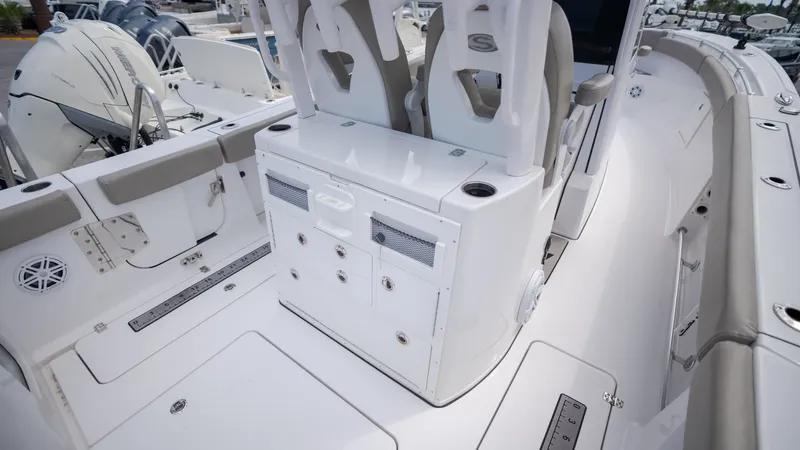 Slide: The Image of The image shows the cockpit of a 2023 Sportsman Open 282TE Center Console boat. - 31
