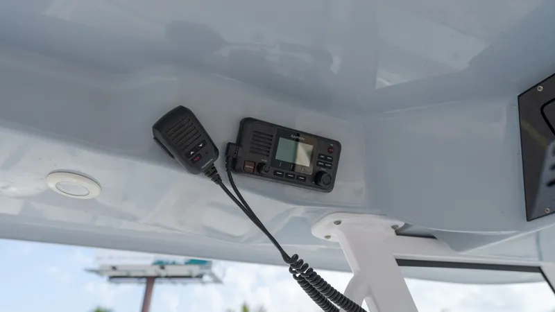 Slide: The Image of Radio mounted under the roof of a Sportsman Open 282TE Center Console boat. - 17