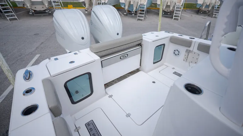 Slide: The Image of The image shows the cockpit of a 2023 Sportsman Open 282TE Center Console boat. - 32
