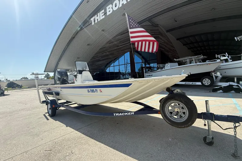 Slide: The Image of 2010 Tracker Grizzly 1860 SC Blind Duck Edition boat on trailer with American flag. - 4