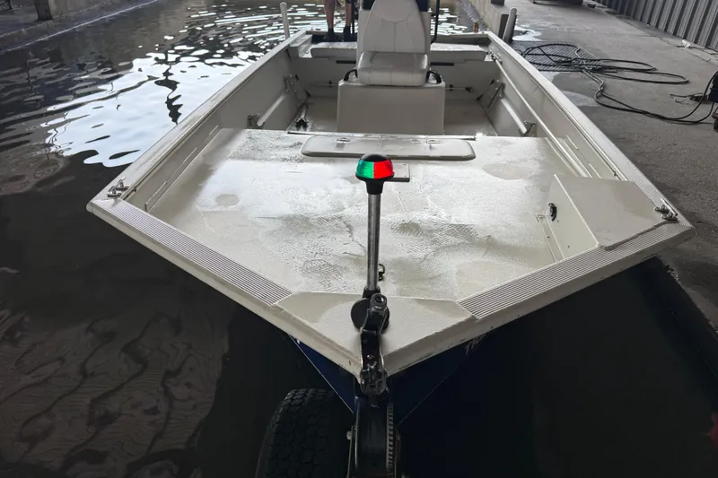 Slide: The Image of 2010 Tracker Grizzly 1860 SC Blind Duck Edition boat docked in a marina. - 13