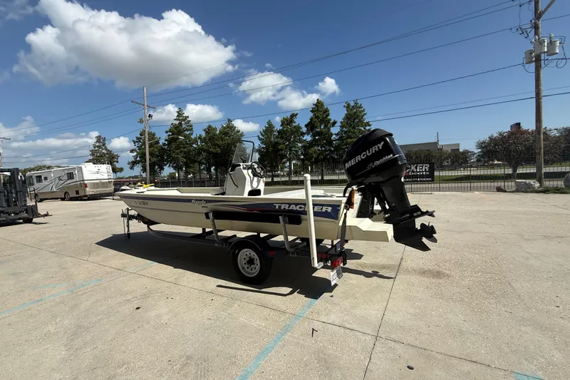 Slide: The Image of 2010 Tracker Grizzly 1860 SC Blind Duck Edition boat with Mercury outboard motor on trailer. - 7