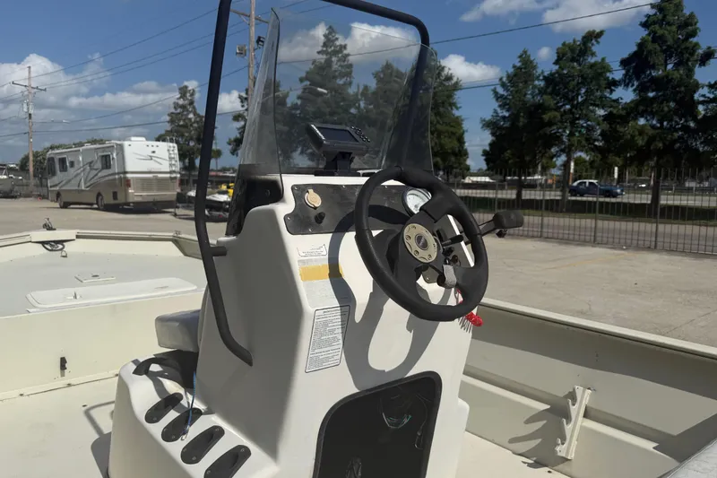 Slide: The Image of 2010 Tracker Grizzly 1860 SC Blind Duck Edition boat console with steering wheel. - 9