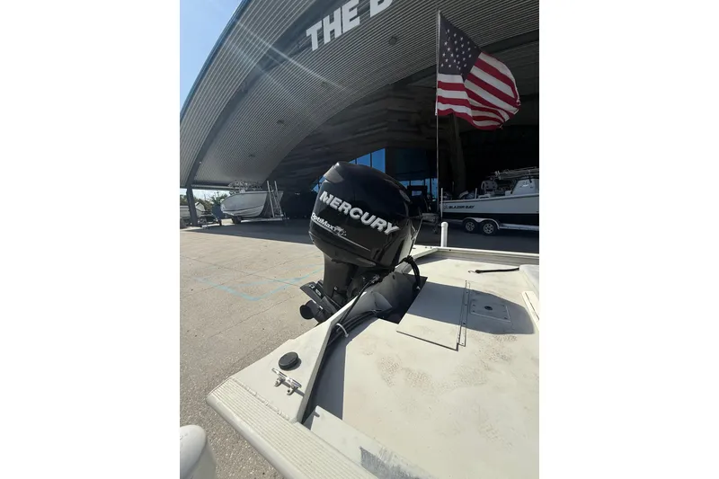 Slide: The Image of 2010 Tracker Grizzly 1860 SC Blind Duck Edition with Mercury outboard motor and American flag. - 11