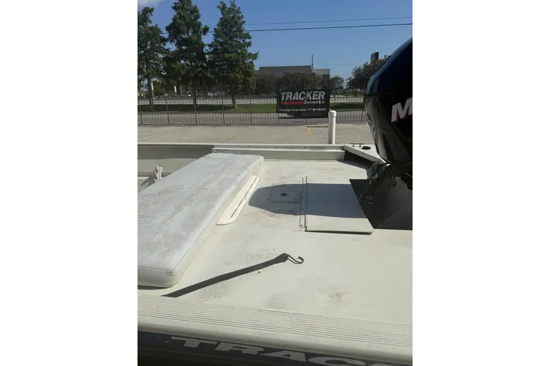 Slide: The Image of 2010 Tracker Grizzly 1860 SC Blind Duck Edition boat with motor, outdoor setting. - 14