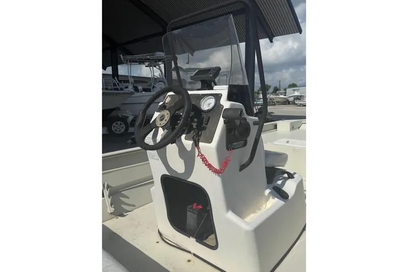Slide: The Image of 2010 Tracker Grizzly 1860 SC Blind Duck Edition boat console with steering wheel. - 12