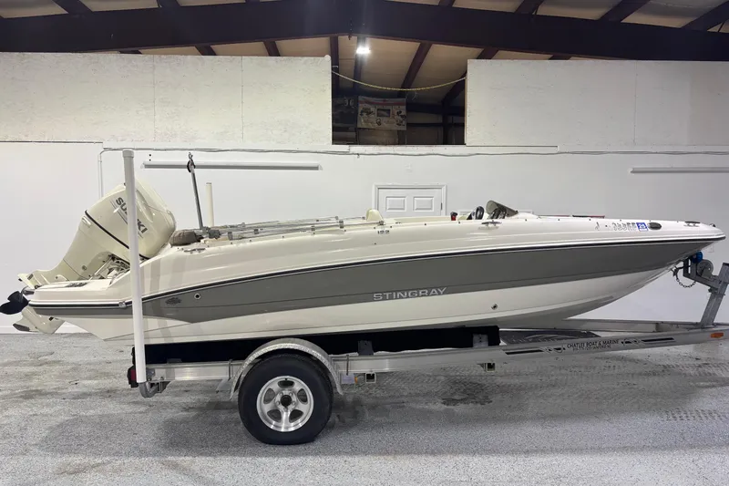 Slide: The Image of 2017 Stingray 182 SC boat on trailer in indoor storage facility. - 2