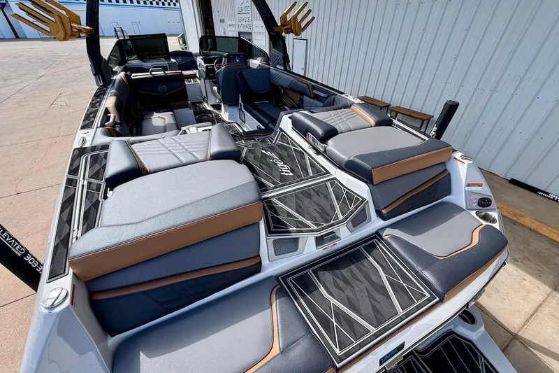Slide: The Image of 2025 Tigé Ultré 25ZX boat interior with luxurious seating and modern design. - 11