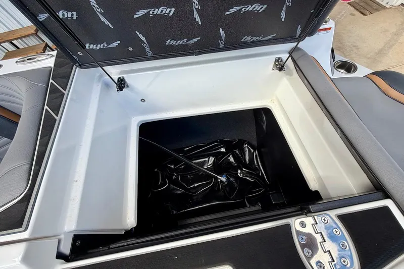 Slide: The Image of Storage compartment of 2025 Tigé Ultré 25ZX boat, featuring sleek interior design. - 47