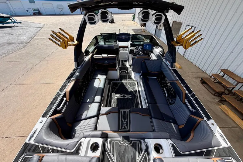 Slide: The Image of 2025 Tigé Ultré 25ZX luxury boat interior with sleek seating and advanced controls. - 14