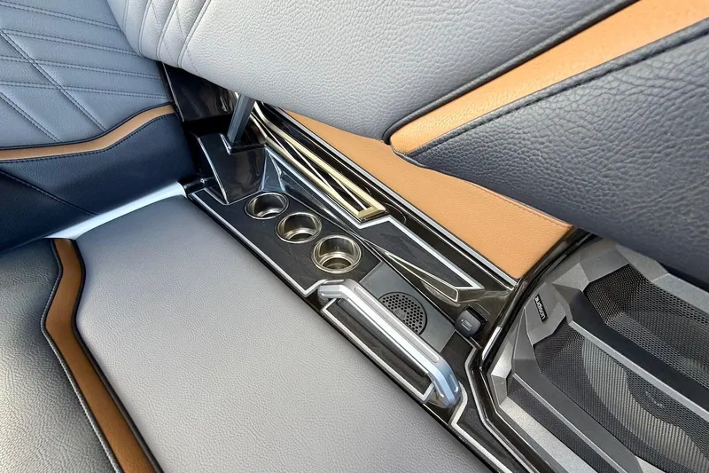 Slide: The Image of Interior of 2025 Tigé Ultré 25ZX boat with cup holders and premium seating. - 41