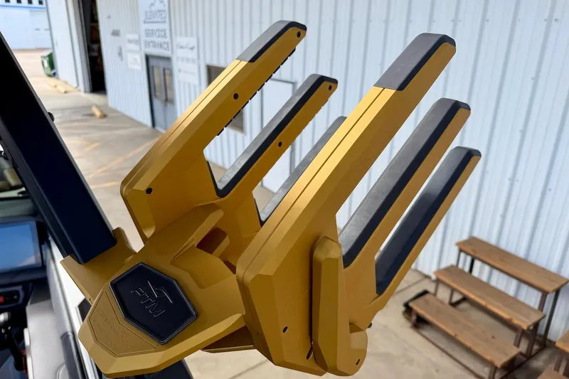 Slide: The Image of Gold wakeboard rack on 2025 Tigé Ultré 25ZX boat, near service entrance. - 50