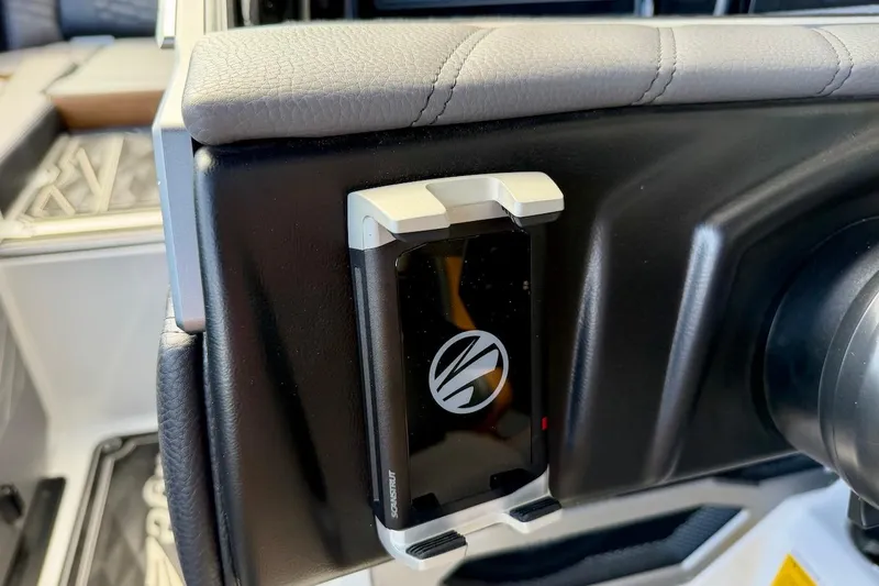 Slide: The Image of 2025 Tigé Ultré 25ZX interior with mounted device holder on dashboard. - 39