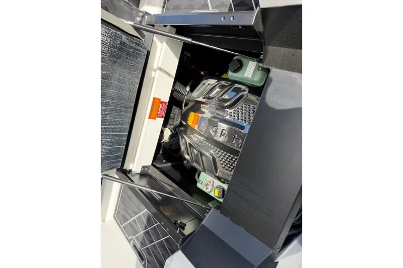 Slide: The Image of Engine compartment of 2025 Tigé Ultré 25ZX boat, showcasing detailed components and design. - 48