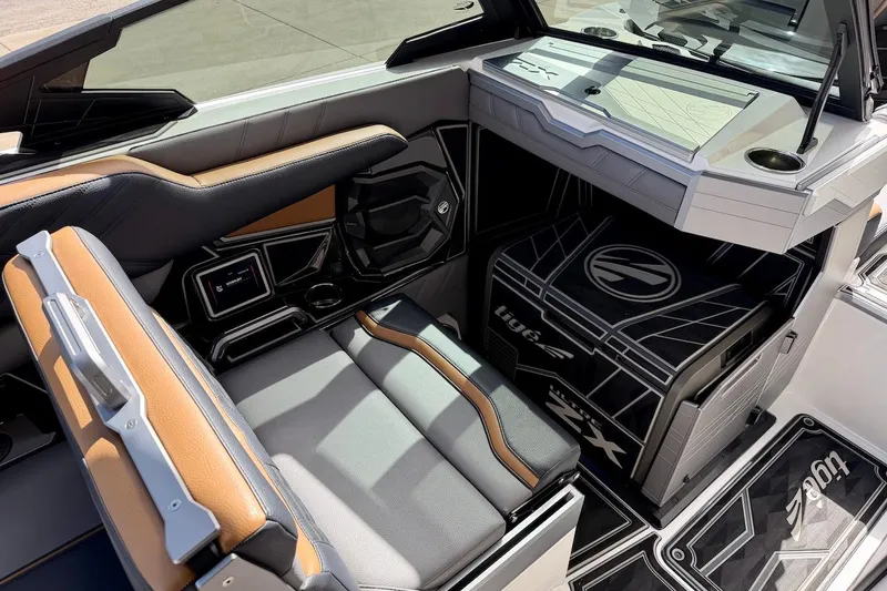 Slide: The Image of Interior of 2025 Tigé Ultré 25ZX boat, featuring sleek seating and modern design elements. - 16