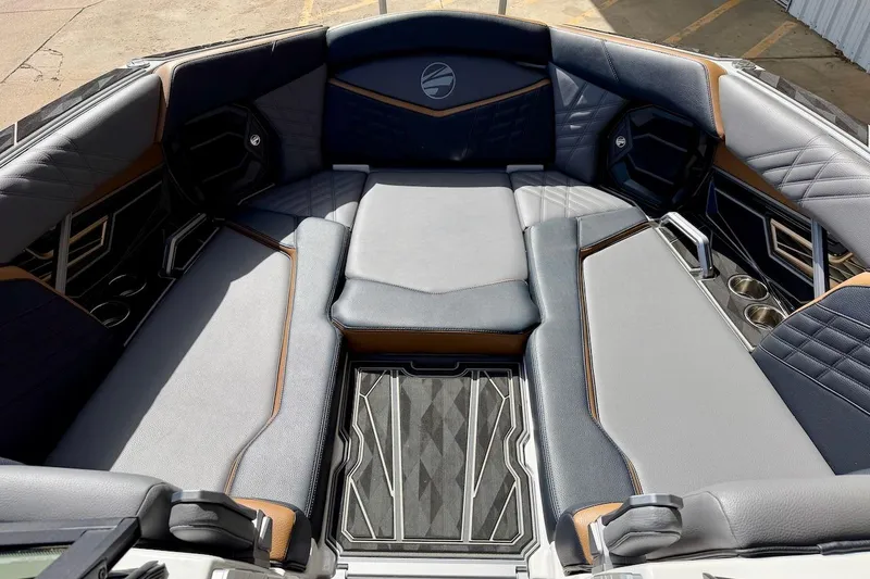 Slide: The Image of Luxurious interior of 2025 Tigé Ultré 25ZX boat with plush seating and modern design. - 17