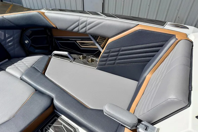 Slide: The Image of Luxurious interior of 2025 Tigé Ultré 25ZX boat with stylish seating and cup holders. - 18