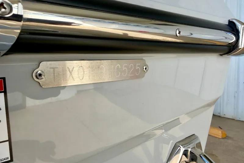 Slide: The Image of 2025 Tigé Ultré 25ZX boat hull identification number plate close-up. - 53